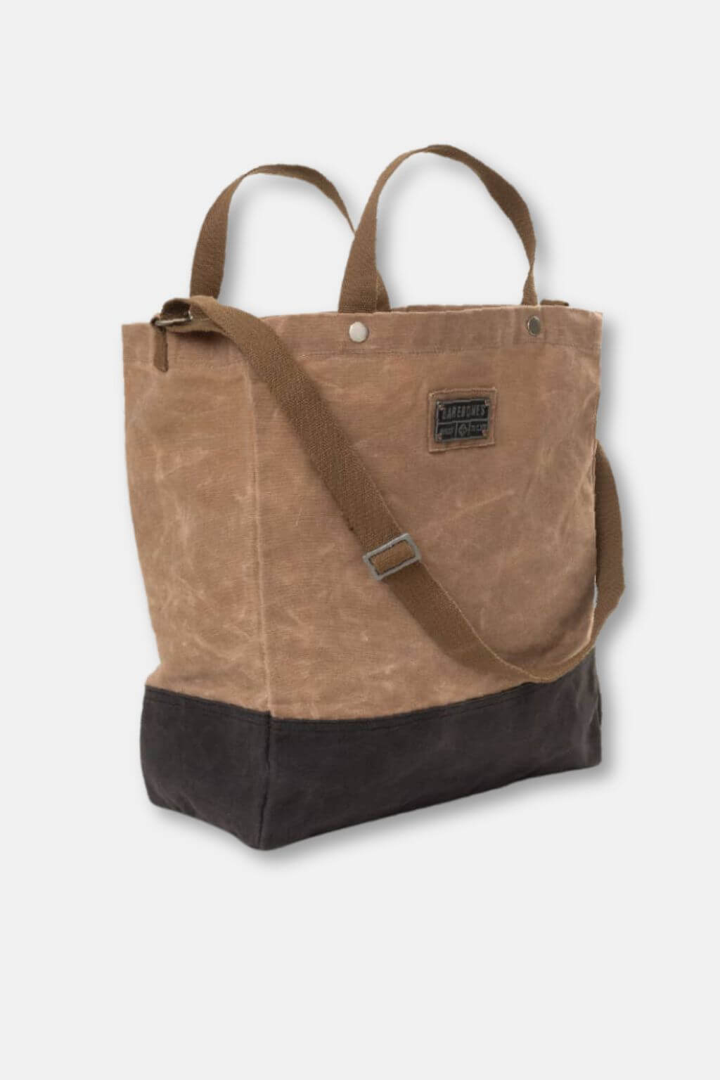 Brown tote bag with a black base on a white background