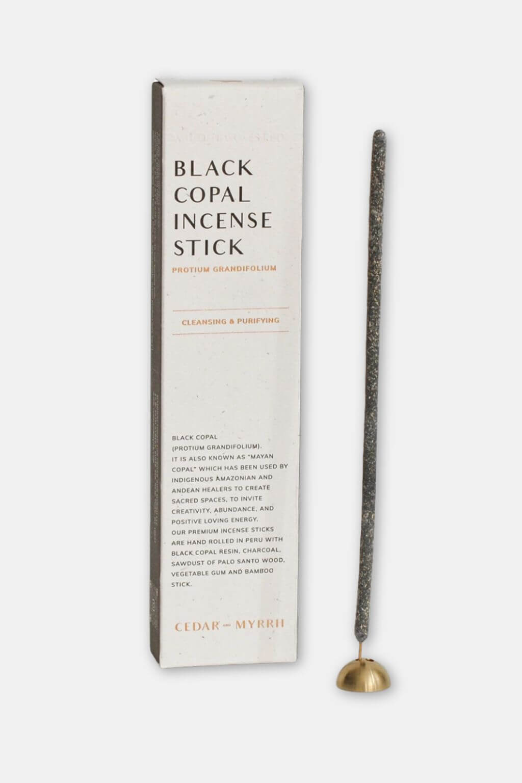 Black copal incense stick with packaging on a white background