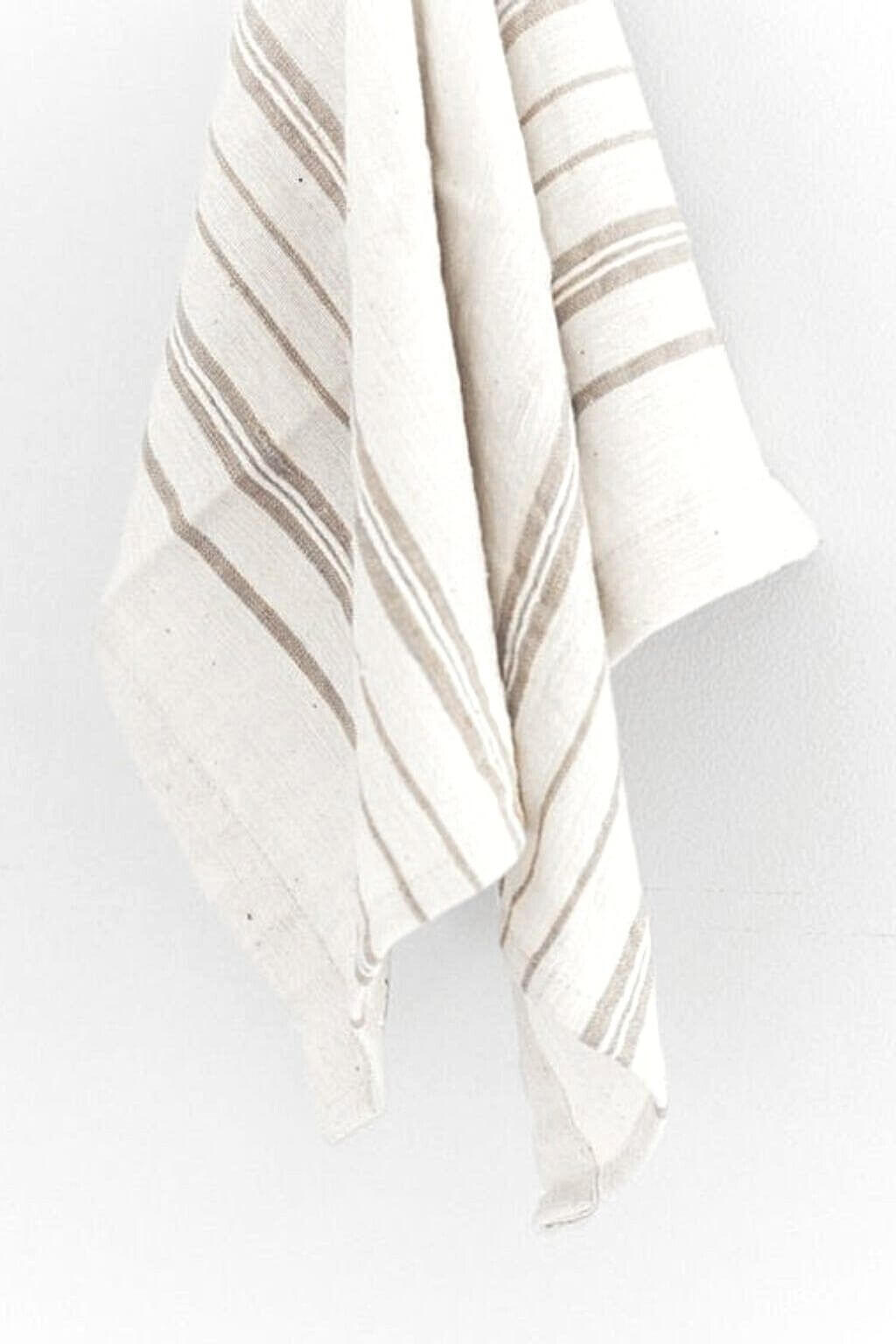 Striped tea towels with light grey stripes on a white background