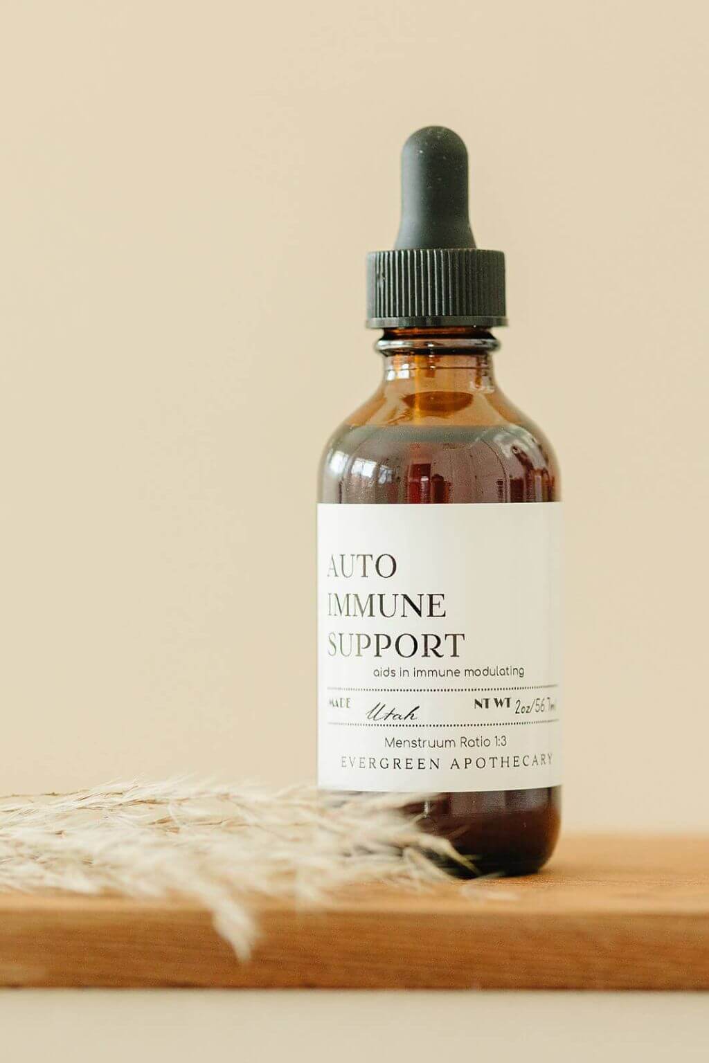 evergreen apothecary autoimmune support herbal tincture bottle with dried wheat styling