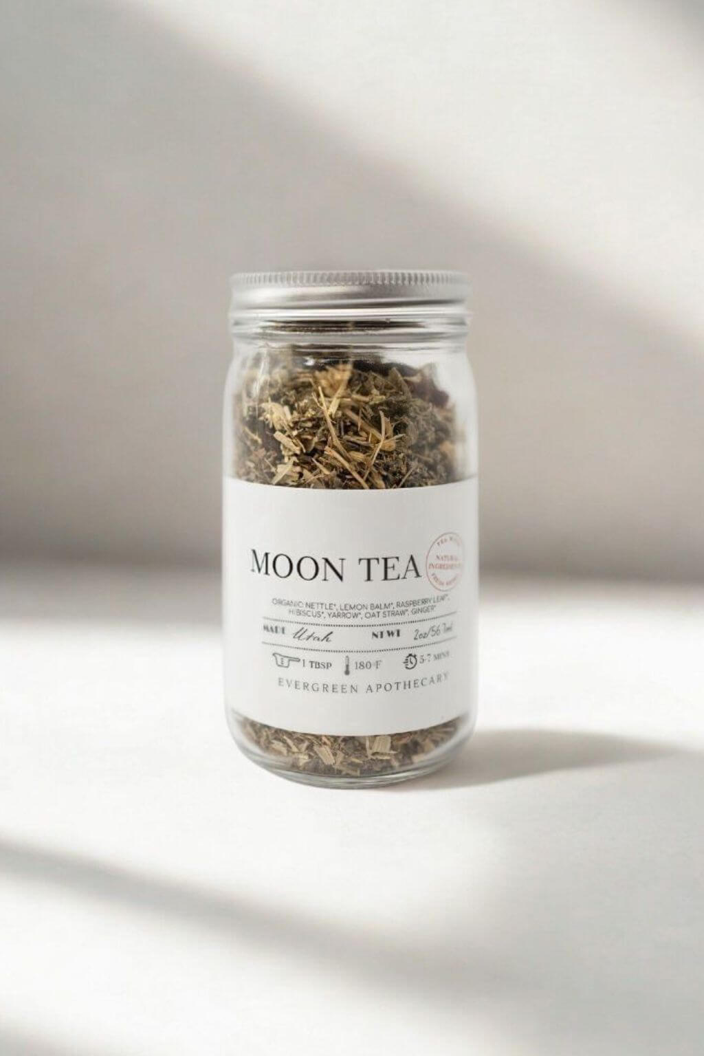 Evergreen Apothecary Moon Tea jar against soft white background with sunlight shadows