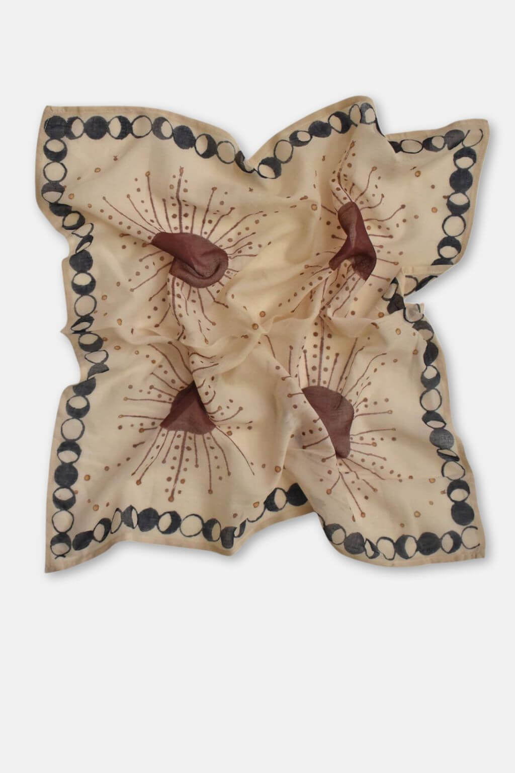 Decorative fabric bandana with brown and beige design on a white background