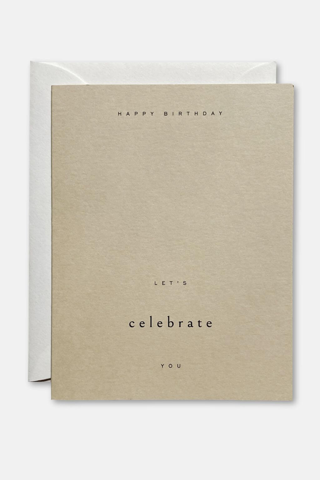 Minimalist birthday card with “Let’s Celebrate You” text on sand-colored paper with envelope
