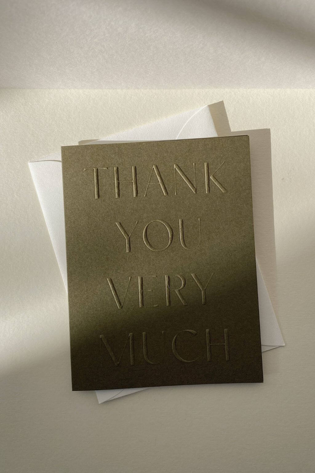 Textured letterpress thank you card in earthy moss tone