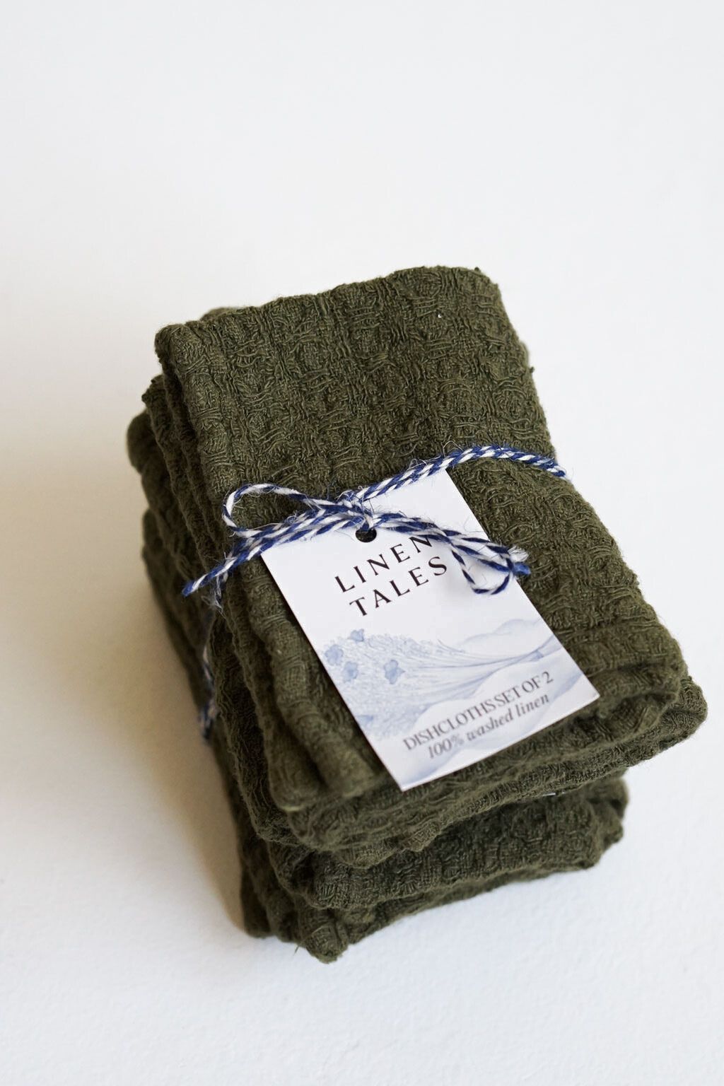 Packaged martini olive linen dishcloth set with artisan product tag