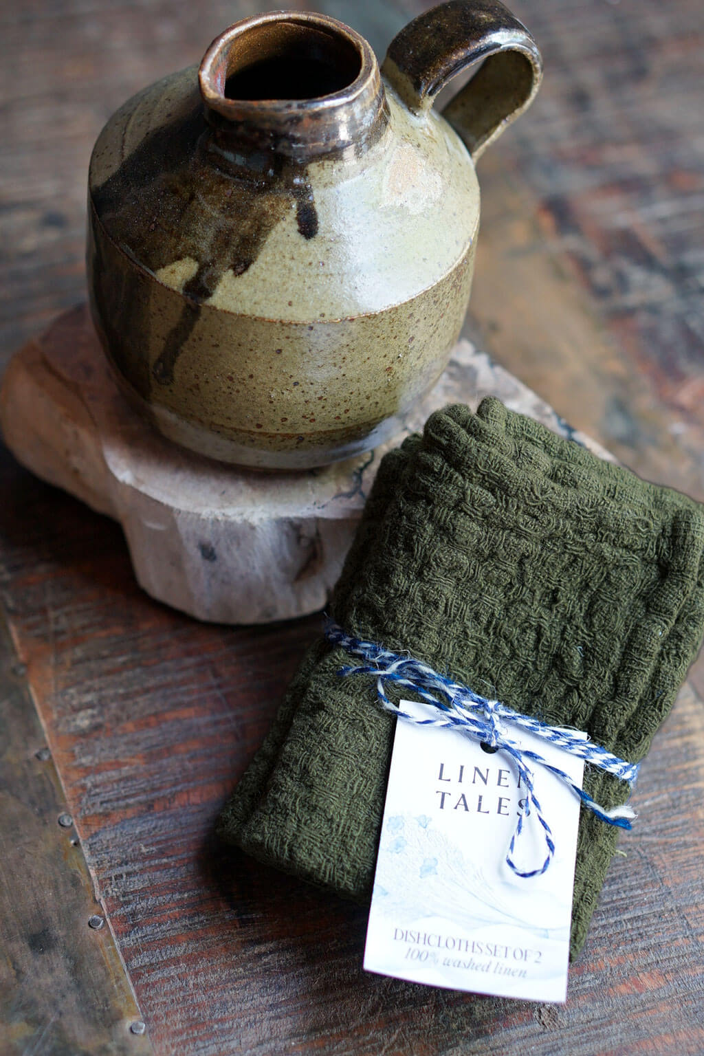Martini olive linen dishcloth set styled with handcrafted ceramic pitcher