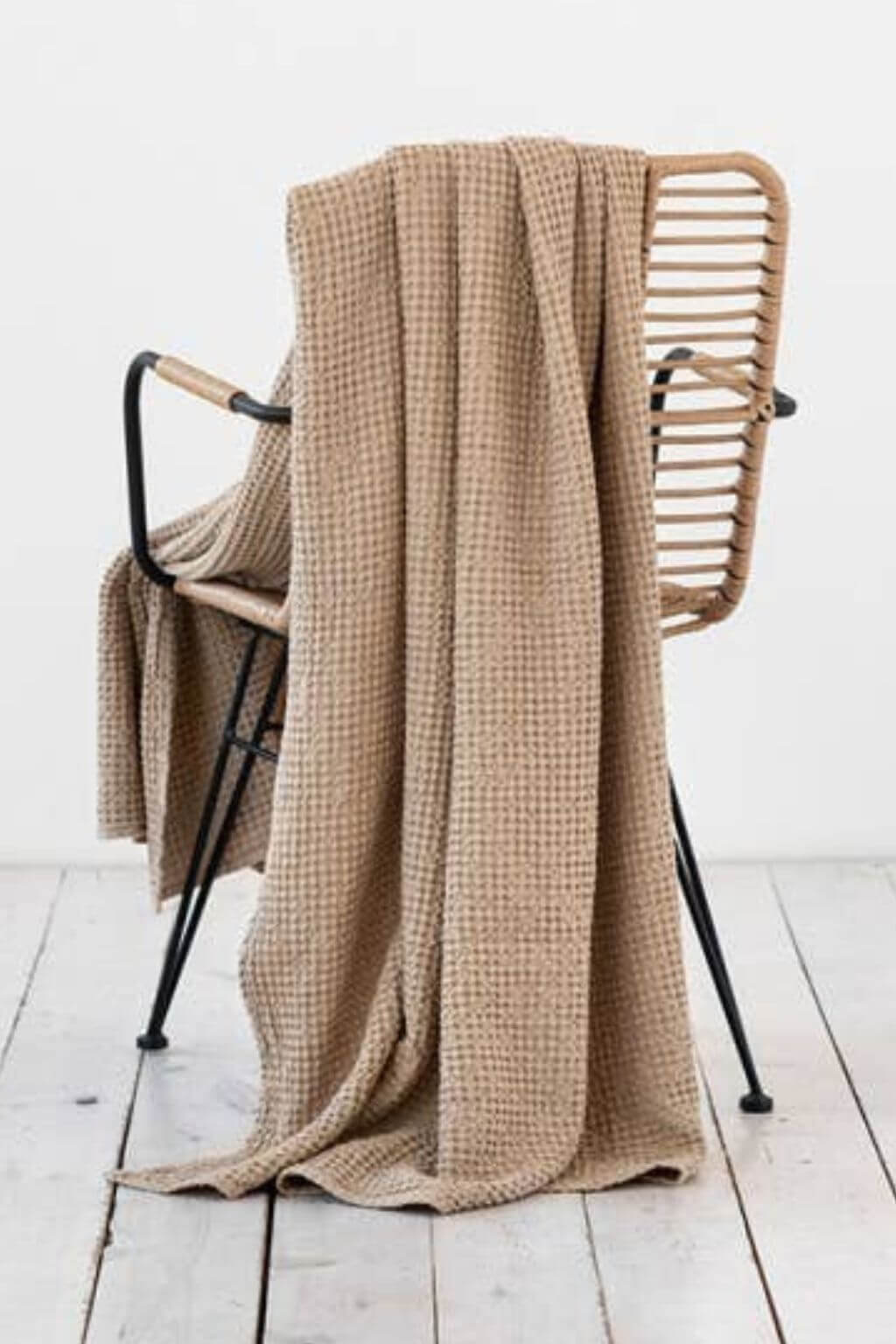 soft beige throw blanket draped over chair