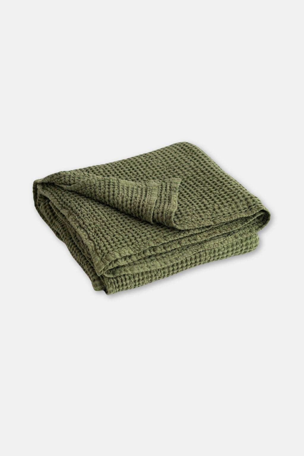 A forest green waffle-knit kitchen towel, folded neatly, displayed on a clean, light gray background.