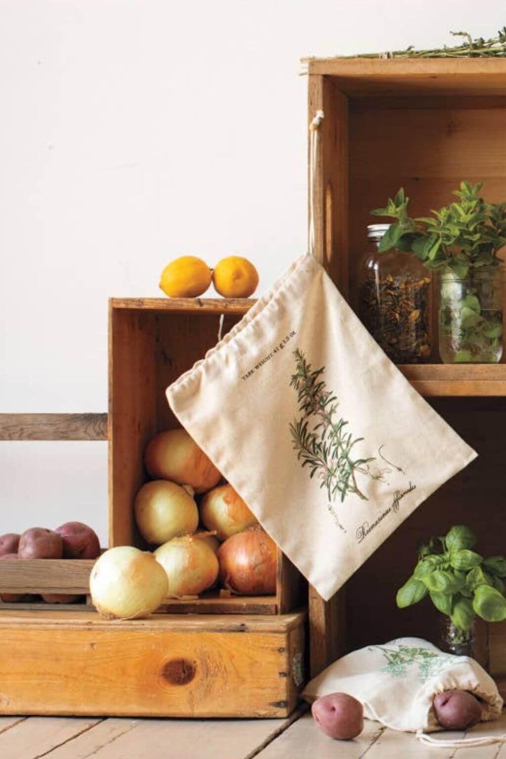 Herb produce bag displayed with vegetables and wooden crates