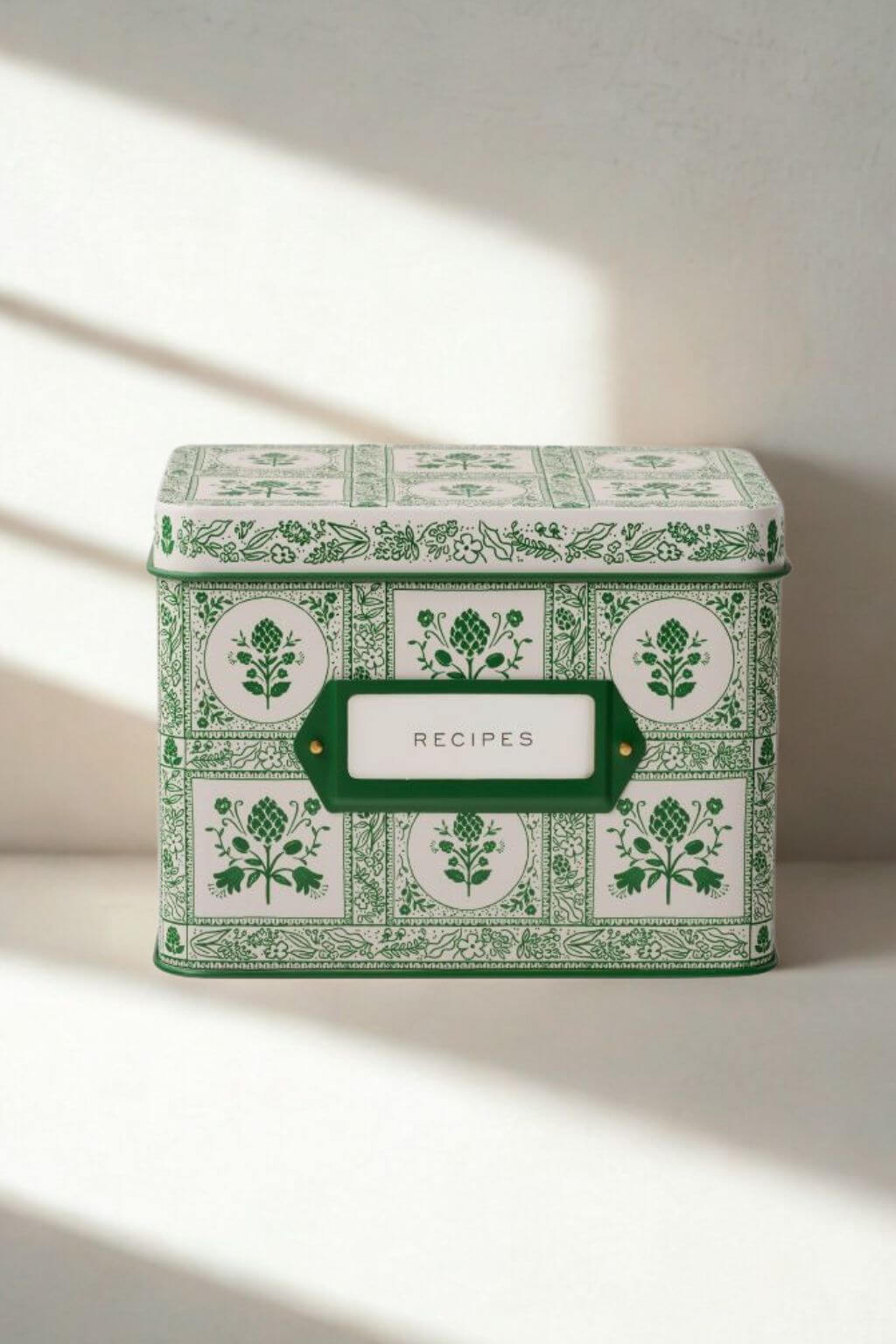 Artichoke Heirloom Recipe Tin in soft morning light with green and white floral motif