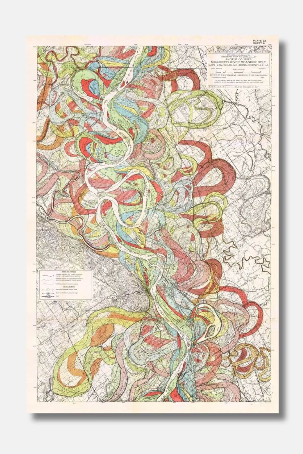 An abstract art print featuring layered, flowing ribbon-like lines in red, green, yellow, and blue over a muted map-style background, shown against a light gray wall.