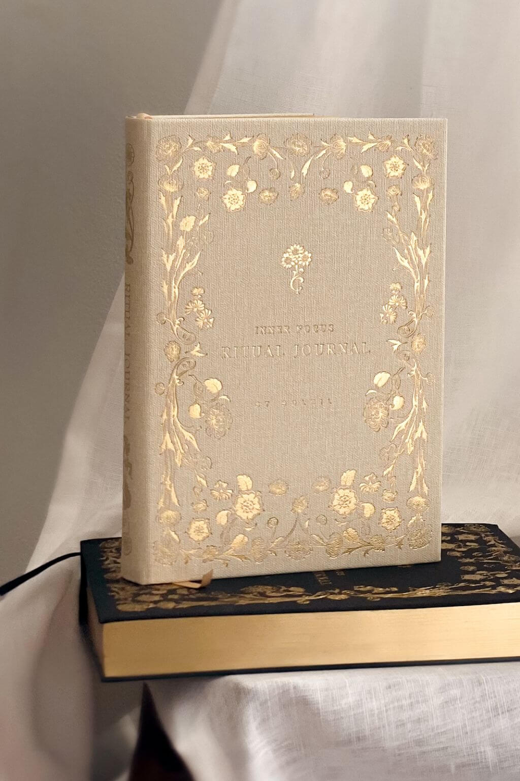Decorative journal with floral patterns on a plain background