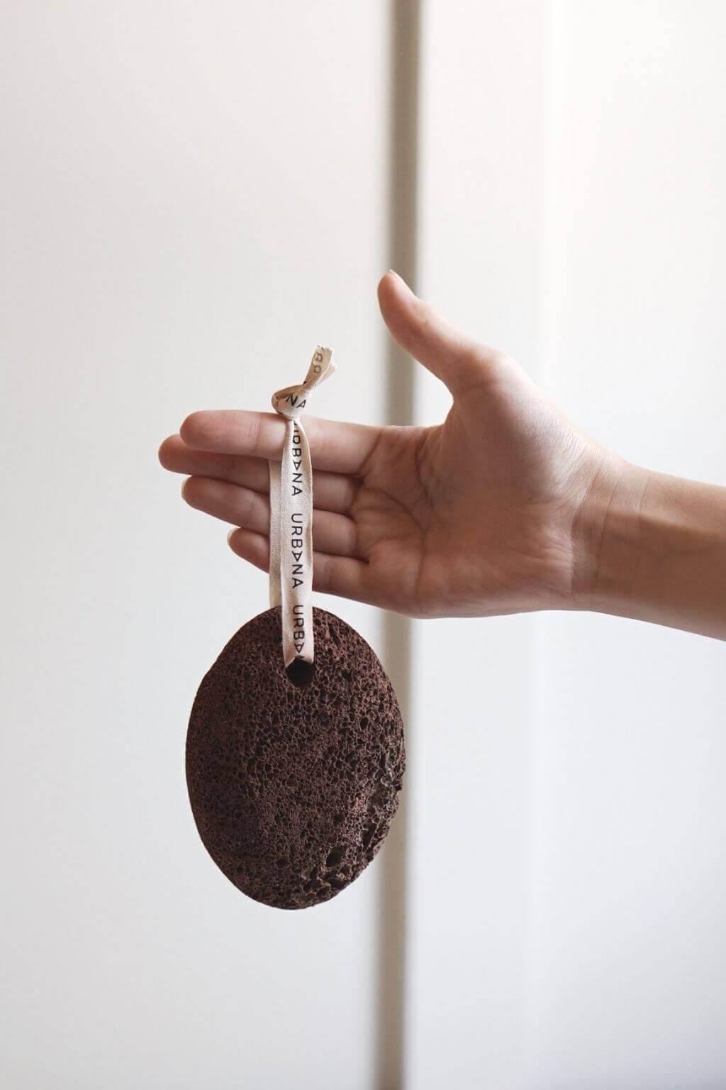 Handheld volcanic lava pumice stone with natural texture for removing dry callused skin