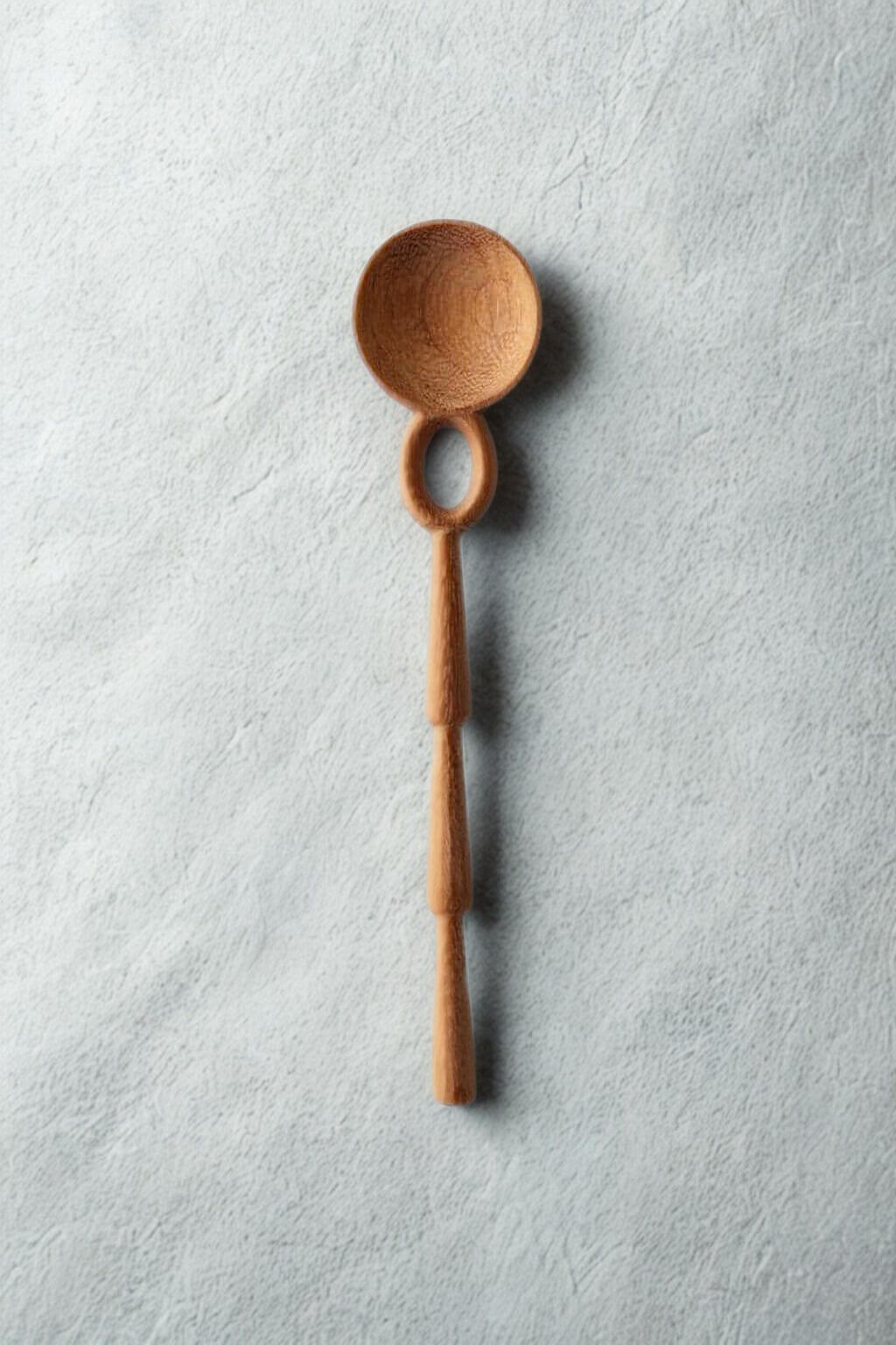 Wooden spoon on a textured gray background