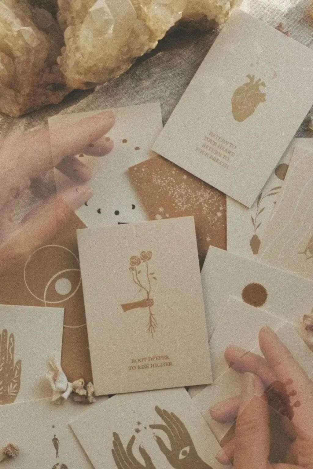 Trust Your Inner Vision affirmation cards arranged with crystals, dried flowers, and hands on linen