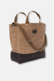 Brown tote bag with a black base on a white background
