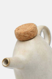 White ceramic olive oil bottle with minimalist design