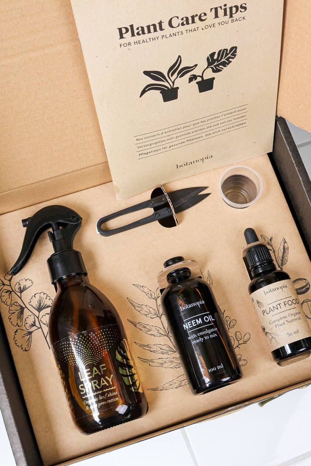Plant care guide and tools inside Botanopia plant care kit