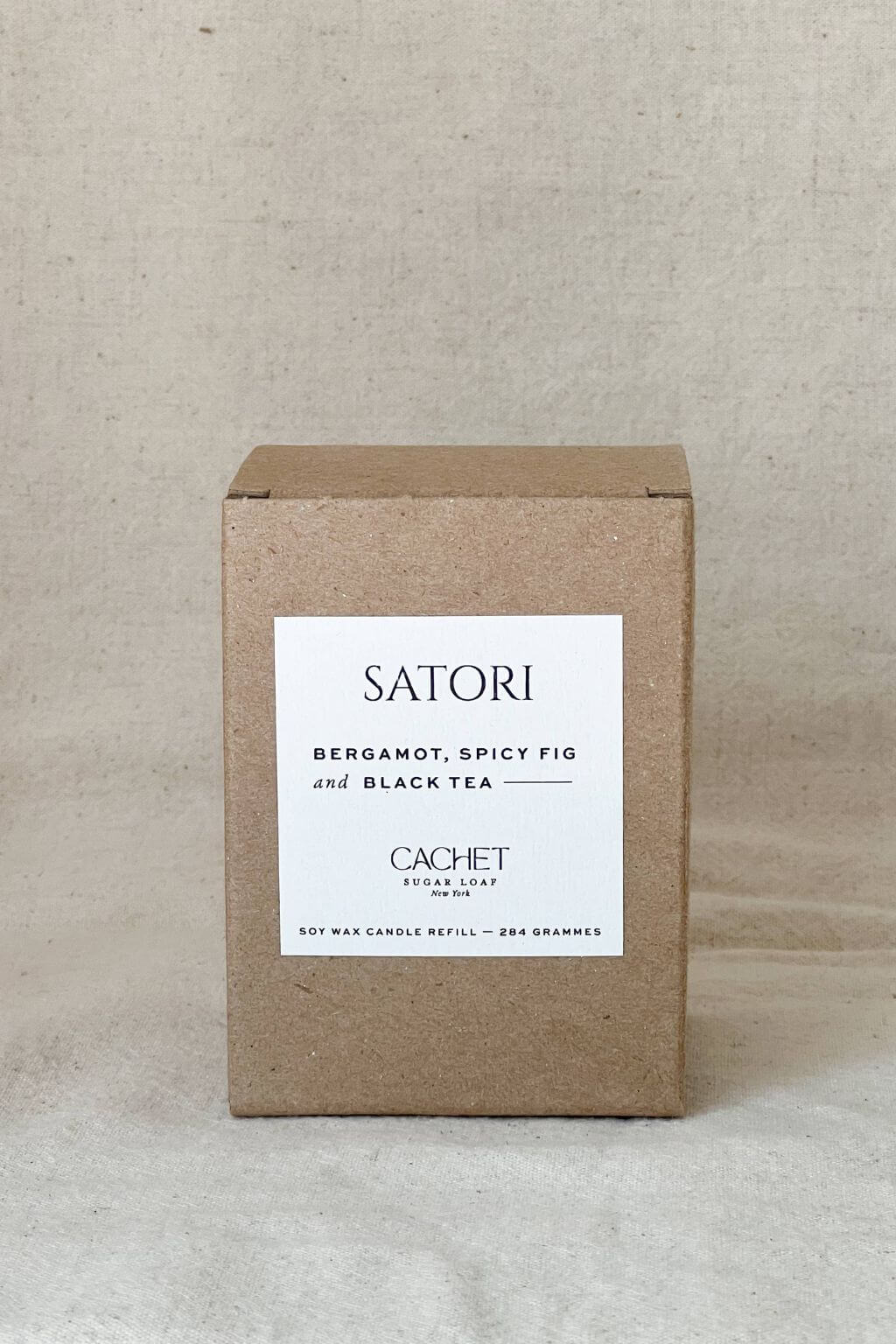 Satori candle box by Cachet on a neutral background