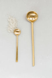 brass olive spoon with salt and small brass spoon comparison