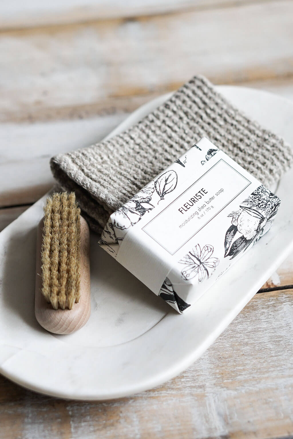 Natural linen waffle dishcloth paired with handmade soap and scrub brush