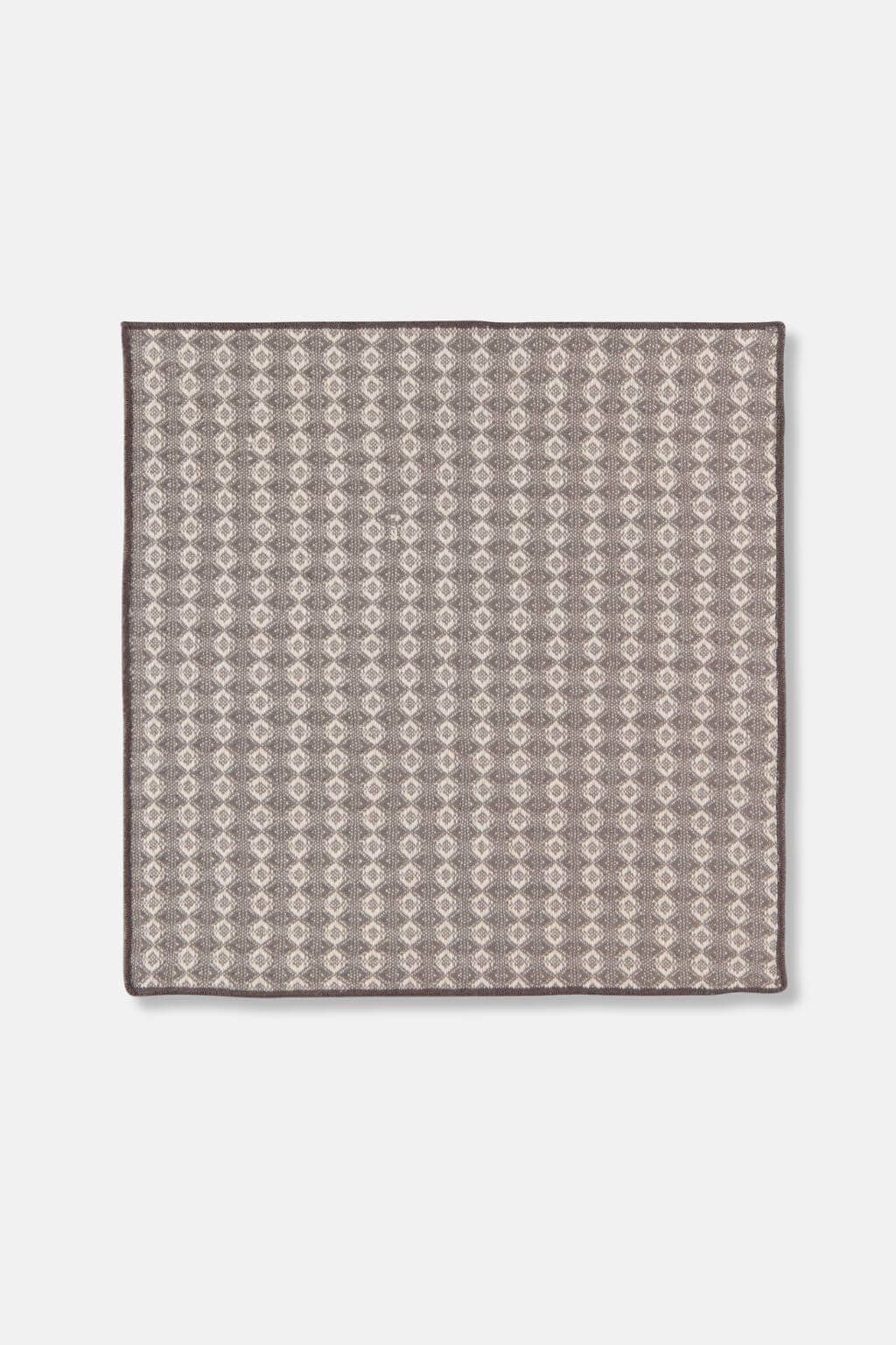 Close-up of woven dishcloth in shadow gray and cream pattern, made from cotton.