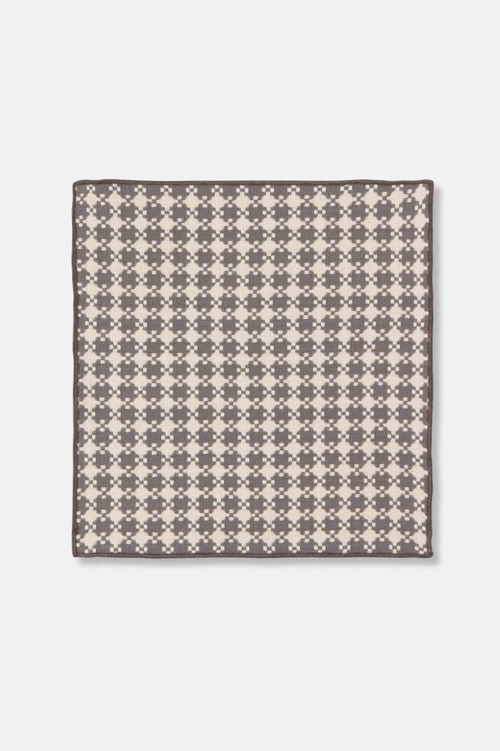 Close-up of woven dishcloth in shadow gray and cream pattern, made from cotton.