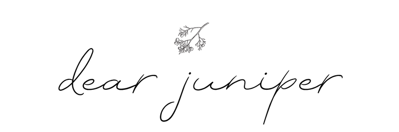 Dear Juniper logo in a minimalistic script with a small botanical accent