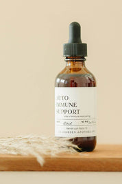 evergreen apothecary autoimmune support herbal tincture bottle with dried wheat styling