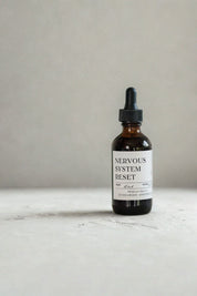 evergreen apothecary nervous system reset herbal tincture in amber dropper bottle