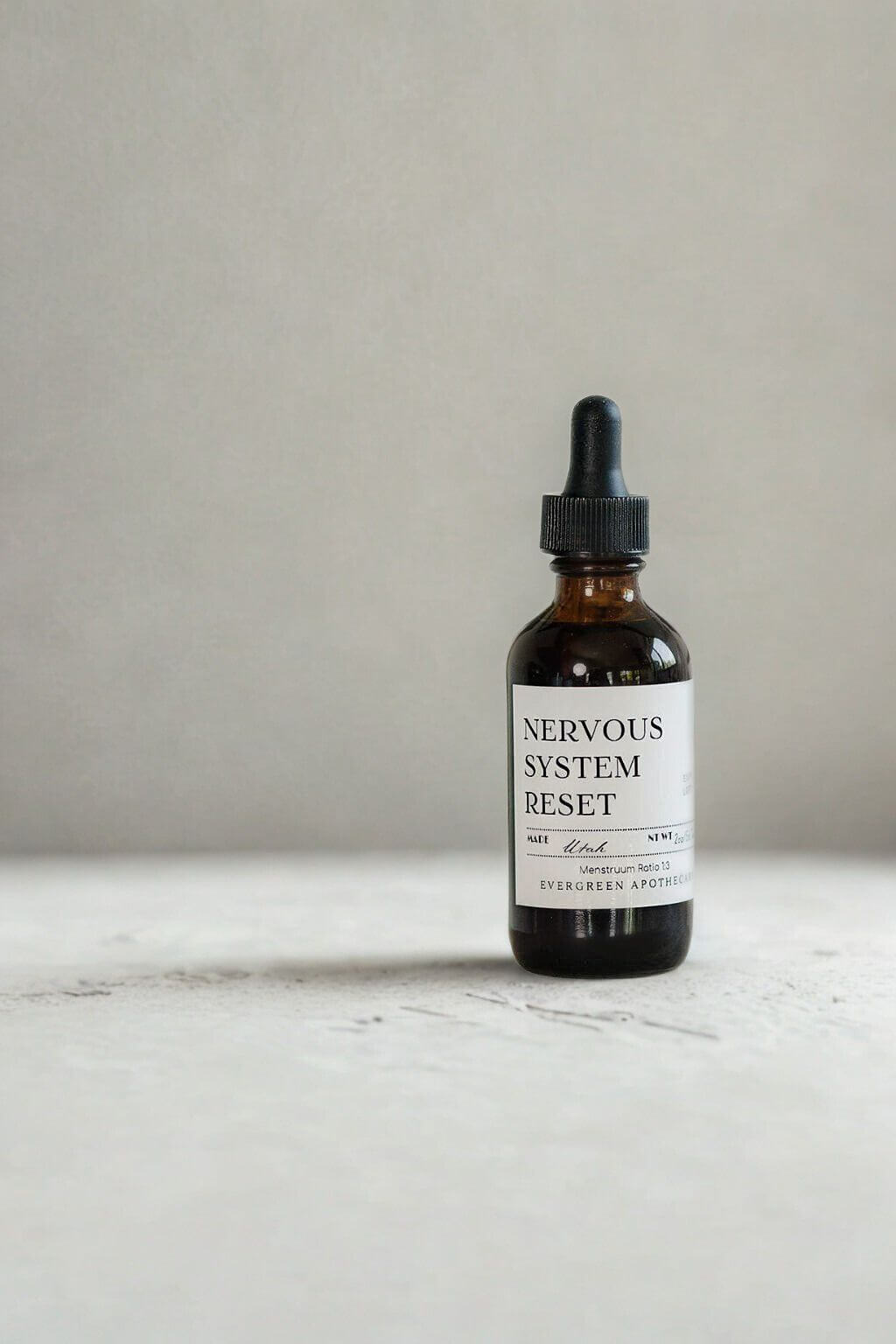 evergreen apothecary nervous system reset herbal tincture in amber dropper bottle