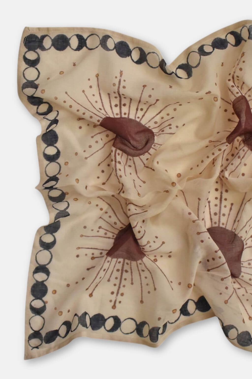 Beige scarf with brown floral patterns on a white background