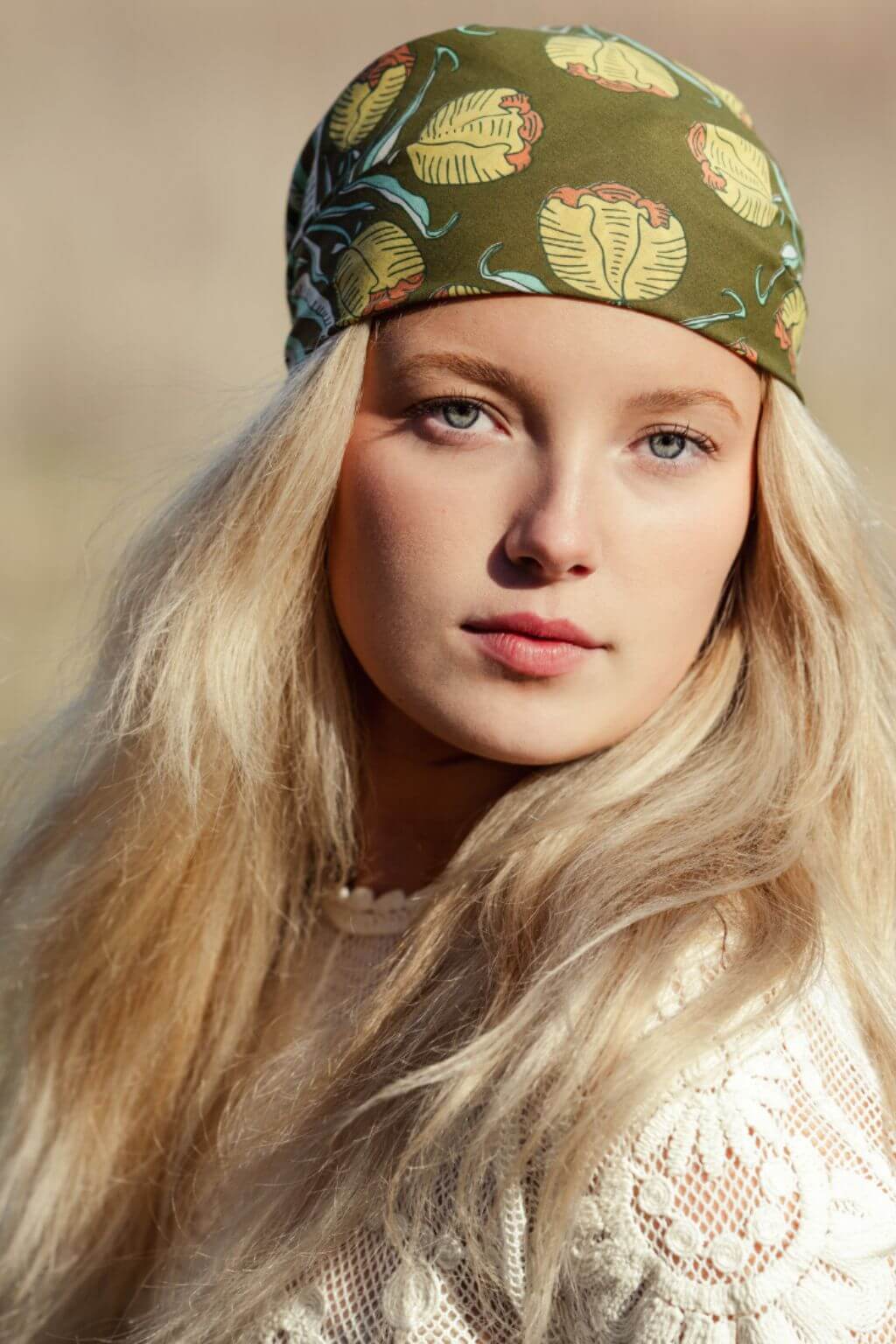 Model wearing bandana as a head scarf