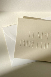 Close-up of blind embossed birthday card in soft sand paper