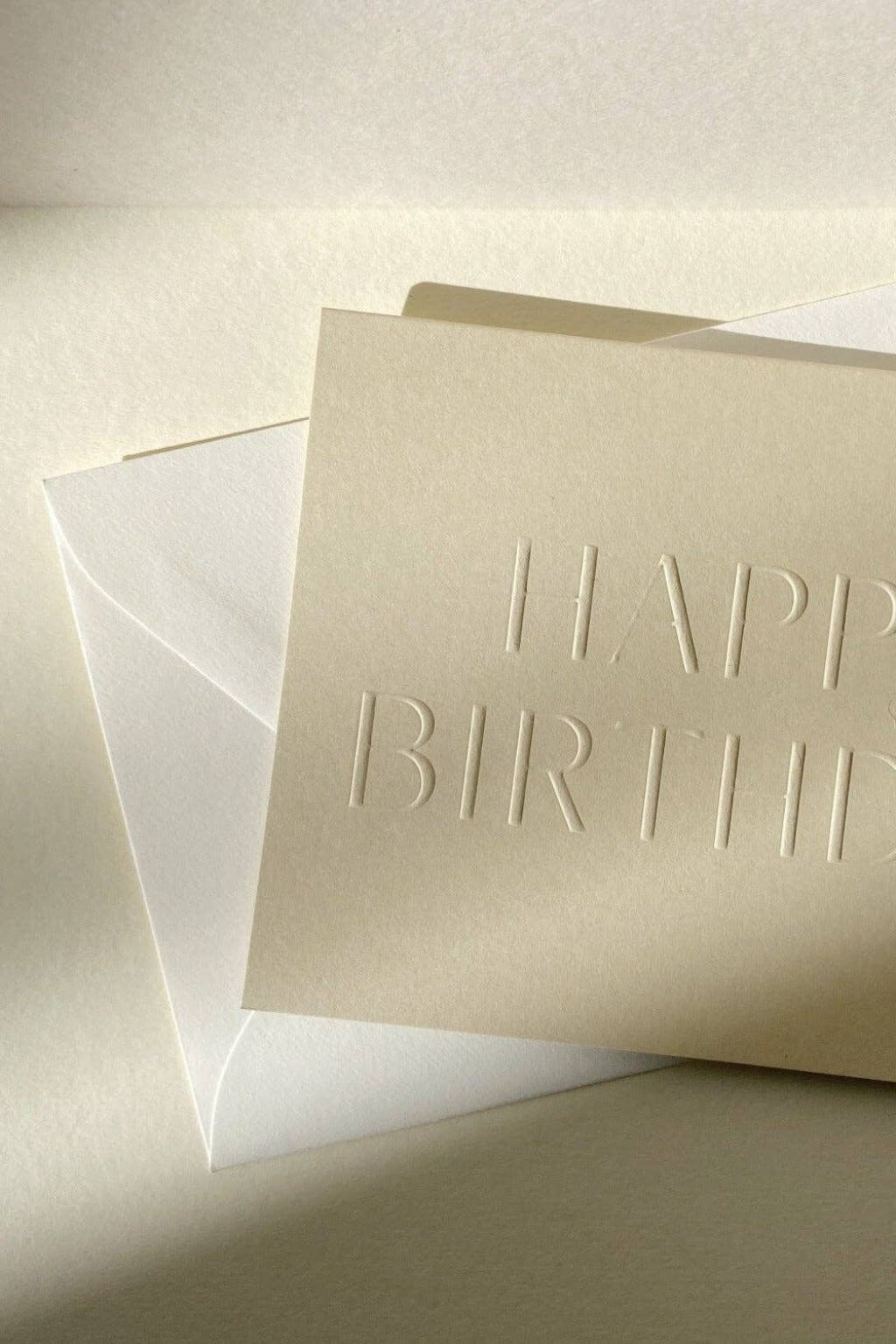 Close-up of blind embossed birthday card in soft sand paper