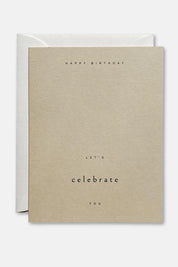Minimalist birthday card with “Let’s Celebrate You” text on sand-colored paper with envelope