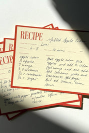 Stack of vintage-inspired recipe cards styled in natural light