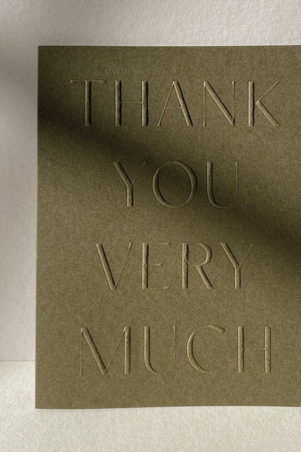 Minimal green thank you card in soft natural light