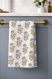 Linen tea towel hanging on brass bar in kitchen