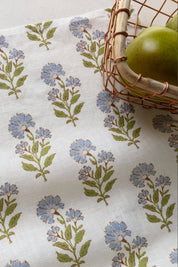 Close-up of marigold pattern on textured linen