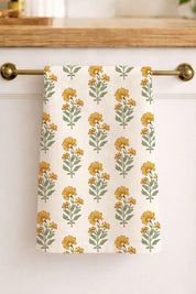 Marigold linen tea towel hanging on brass bar kitchen