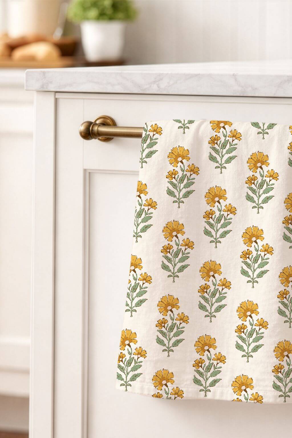 Yellow floral linen tea towel styled in neutral kitchen