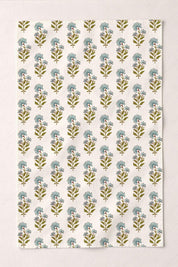 Floral patterned kitchen towel with robin's egg blue and green flowers on a beige background