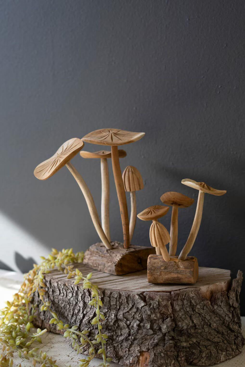Teak wood mushroom decor styled on rustic wood surface