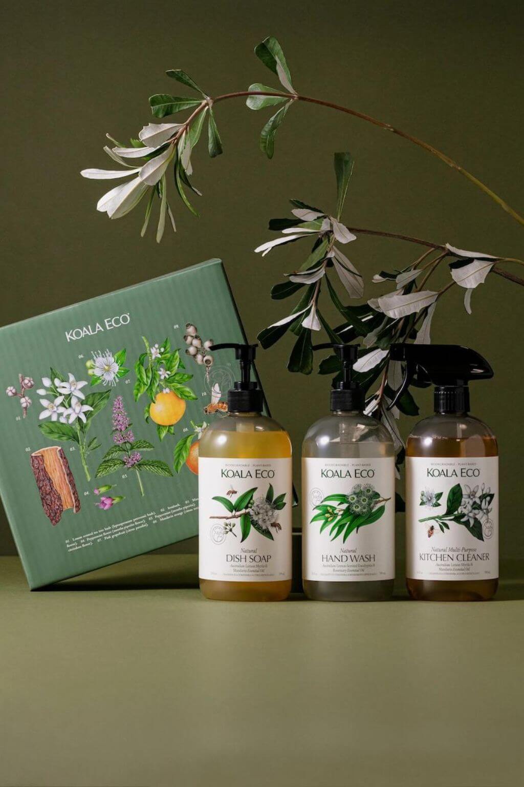 Koala Eco Cleaning Gift Set with hand wash, dish soap, and kitchen cleaner beside illustrated green gift box.