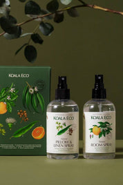A gift set including Natural Pillow + Linen Spray and Natural Room Spray with a green box in the background.