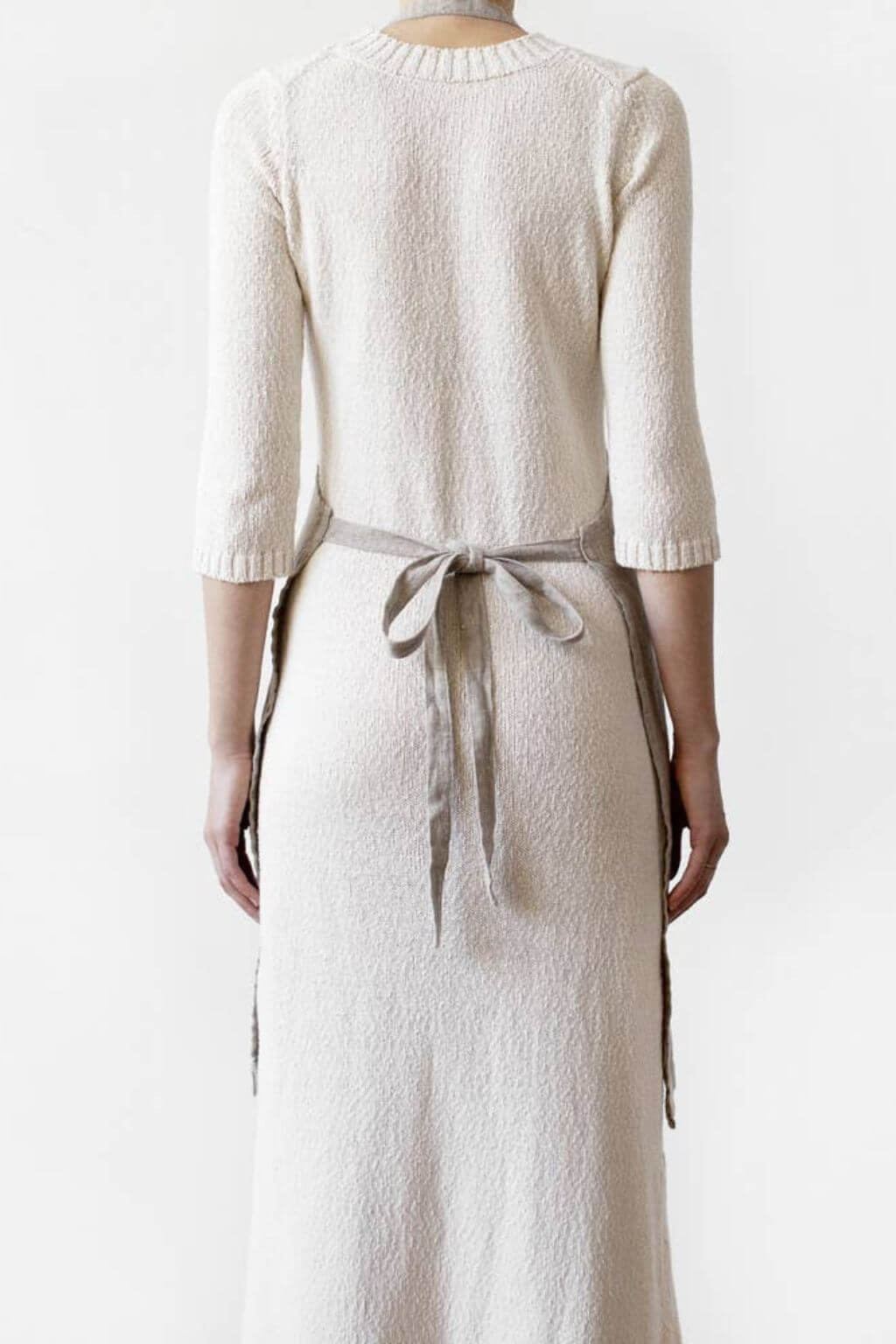 Back view of natural linen daily apron showing tie closure