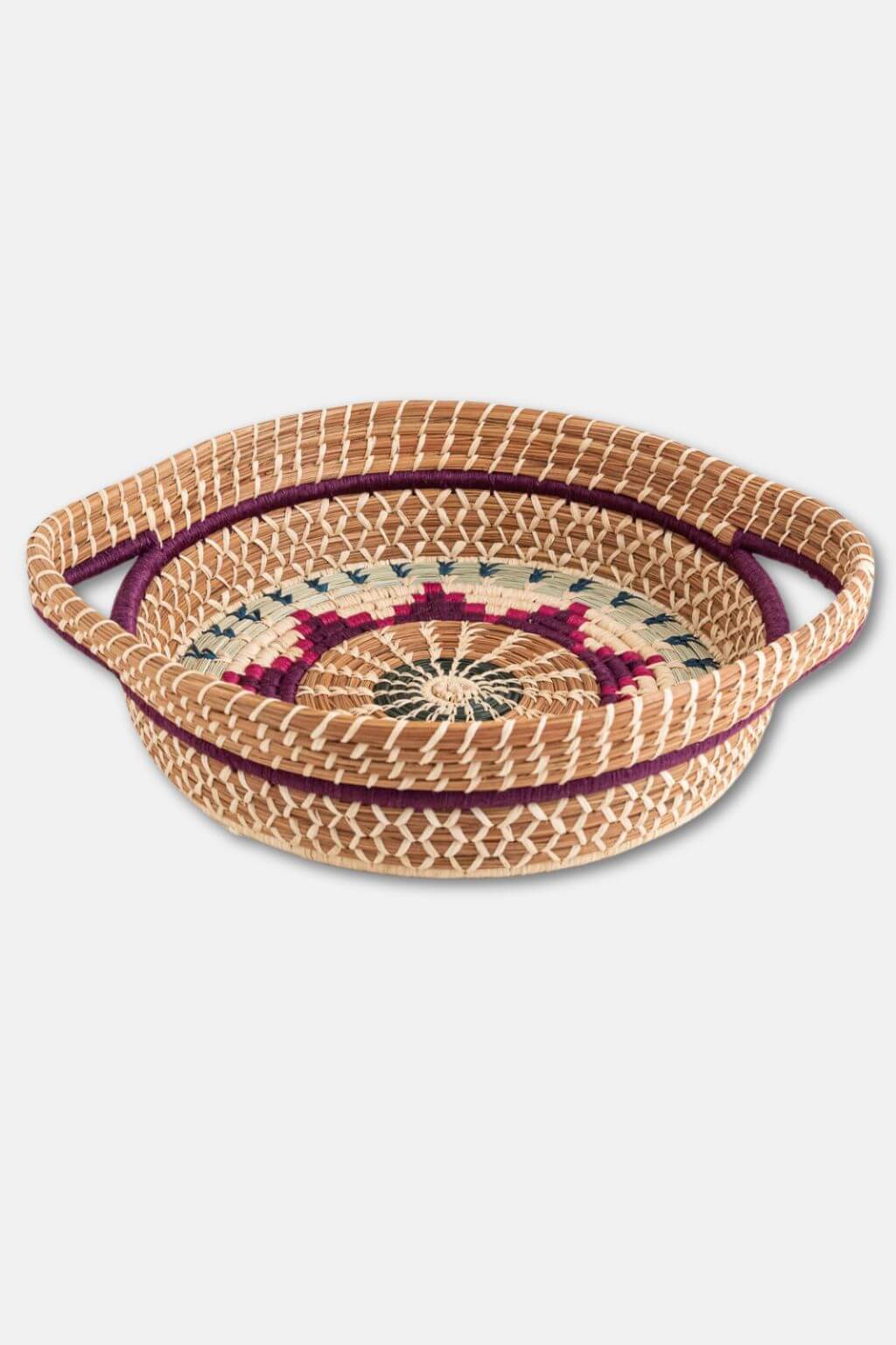 Woven basket with decorative lid on a white background