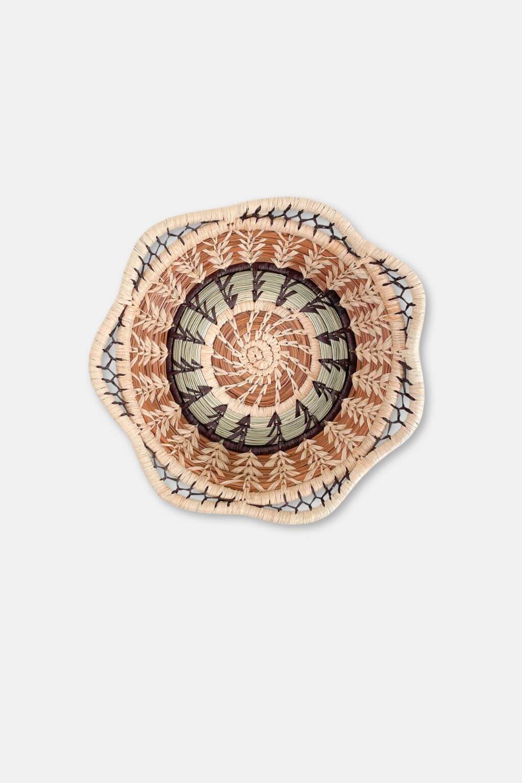 Decorative plate with a spiral pattern on a light gray background