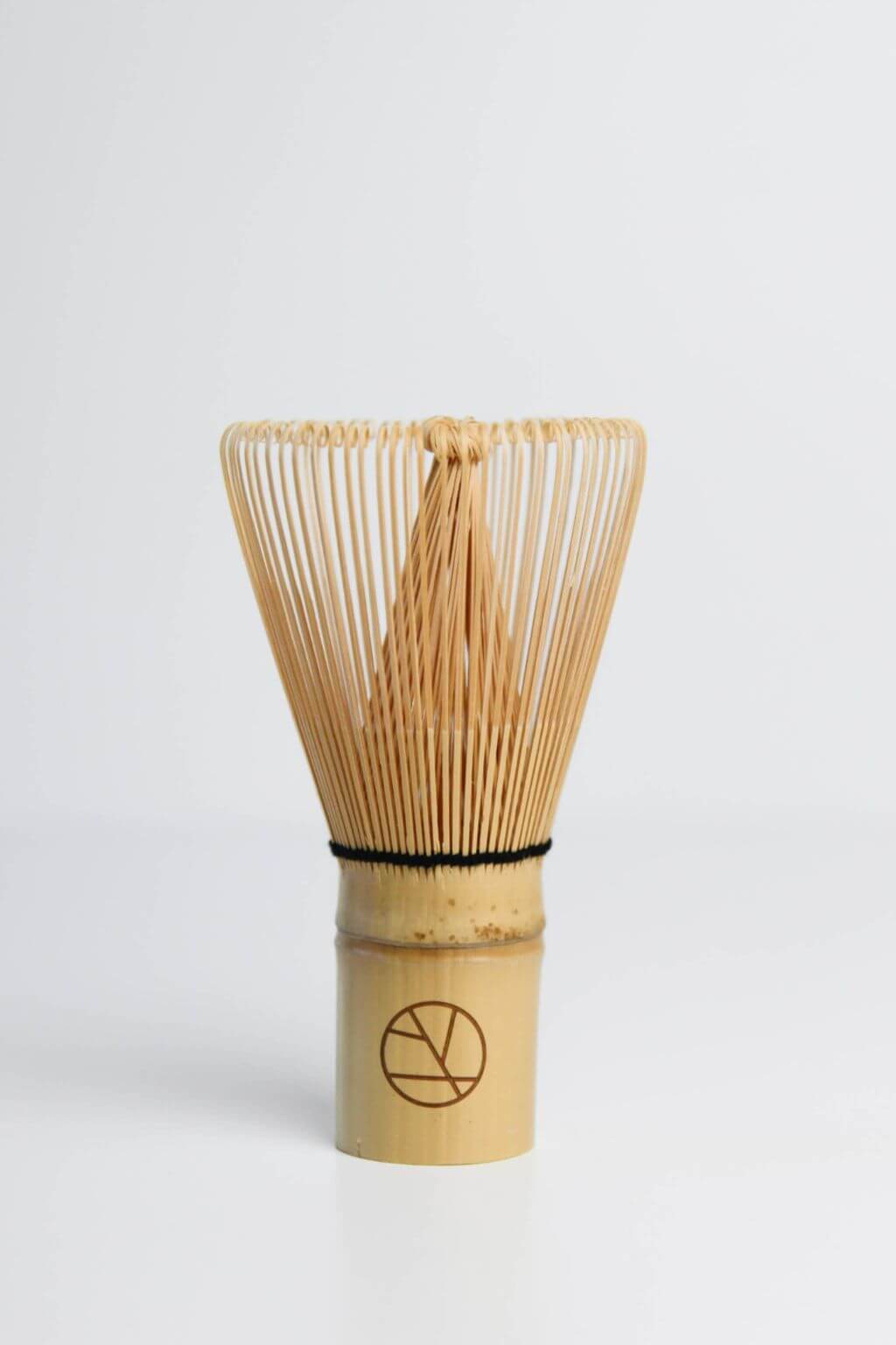 Light bamboo chasen whisk showing fine hand-carved tines